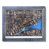 Wooden map of Detroit, Michigan with raised roads, blue water stain, and a black frame. 
