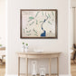 Framed wooden map of Devils Ridge Golf Club on a wall above a wooden table.
