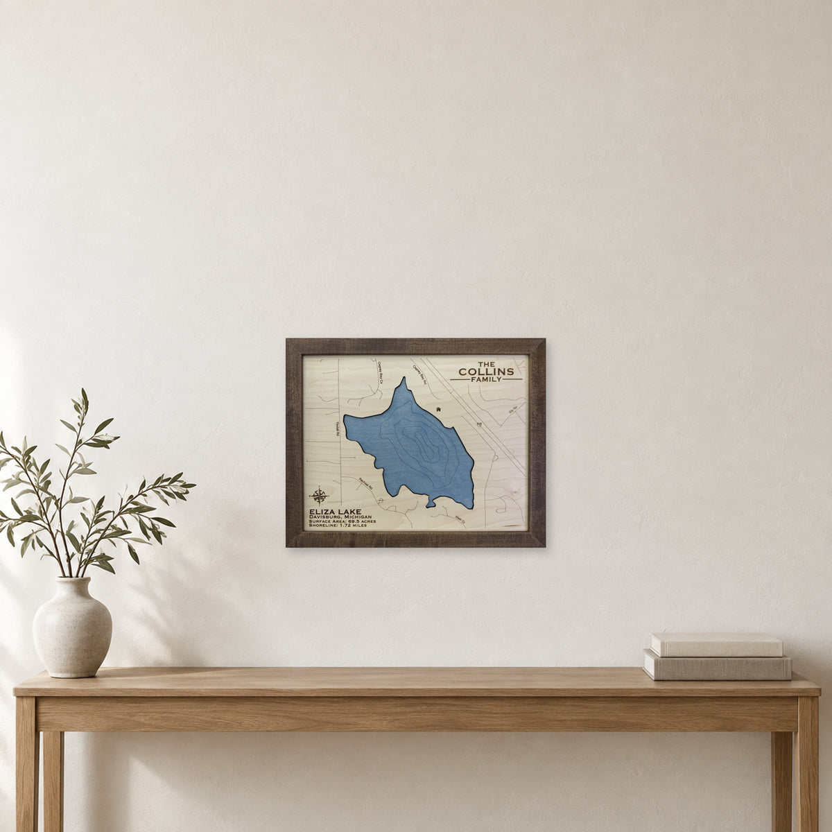 Eliza Collins wood map — single layer with engraved contours, staged room mockup