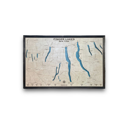 Wooden multilayer map of the Finger Lakes in New York on a white background. 