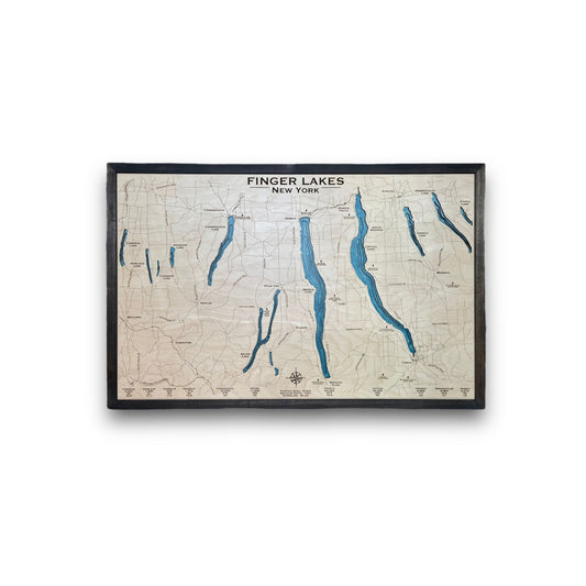 Wooden multilayer map of the Finger Lakes in New York on a white background. 