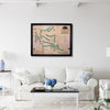 Harmony Landing golf map hanging on a wall above a couch. 