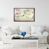 Living room with a white sofa, coffee table, and framed wooden golf map on the wall.
