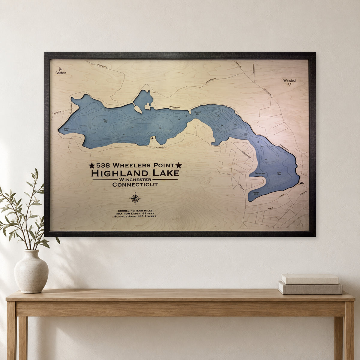 Highland Wheelers wood map — single layer with engraved contours, staged room mockup