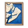 Multilayer wooden map of Hilton Head with a dark blue water stain and walnut frame. 