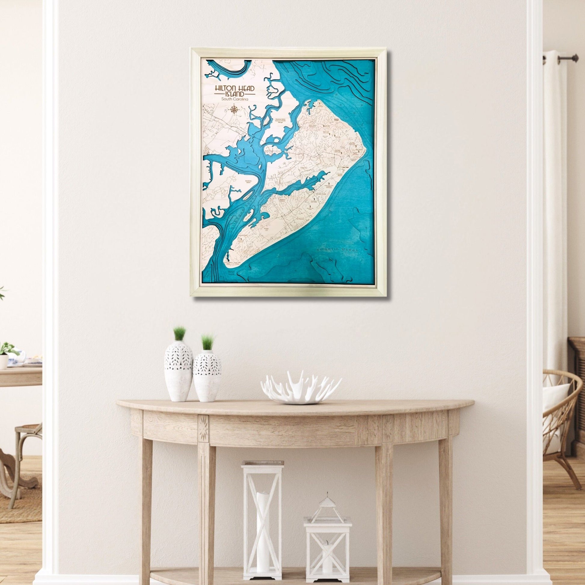 Multilayer Hilton Head wooden map hanging on wall above a table. 