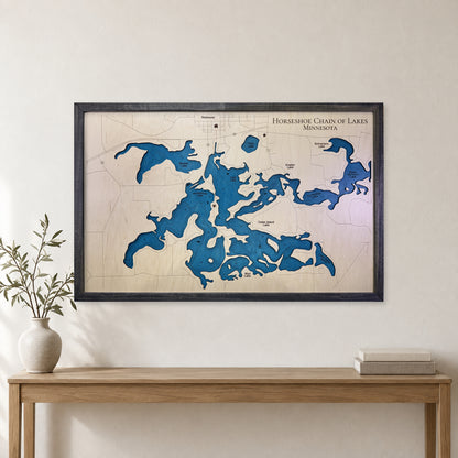 Horseshoe Chain Minnesota wood map — single layer with engraved contours, staged room mockup