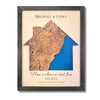 Custom house-shaped map with blue water stain, personalized text, and a black frame. 