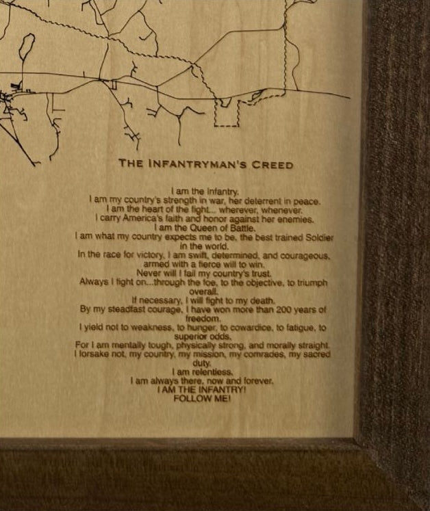 Close up image of The Infantryman's Creed engraved into the wood. 