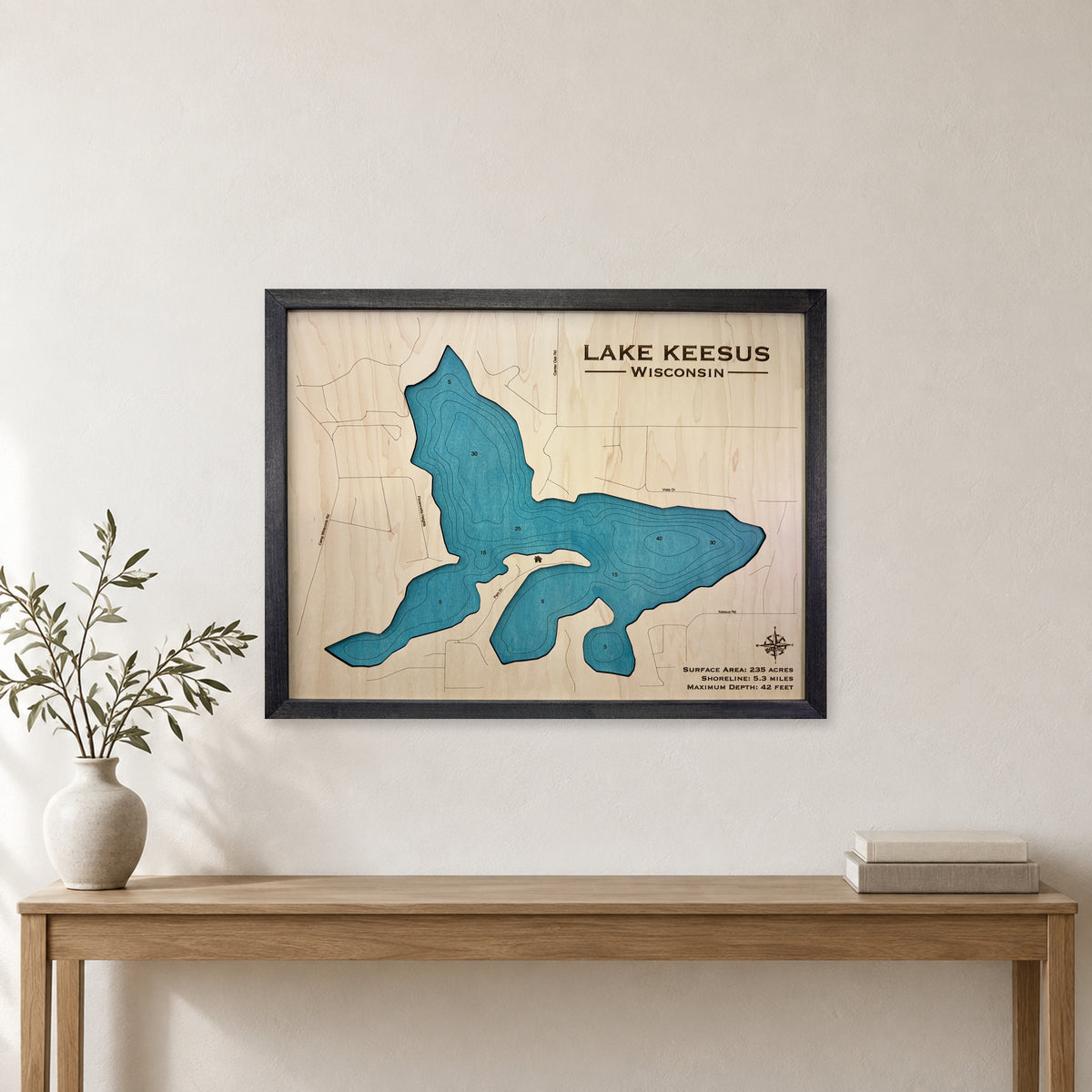 Keesus Black wood map — single layer with engraved contours, staged room mockup