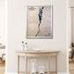 Wooden Lake Champlain map with natural color frame hanging on a wall above a table. 