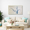 Wooden map of Lake Hartwell hanging on a wall in a living room above a sofa. 