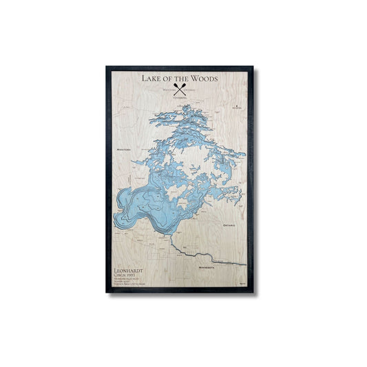 Wooden multi water layer map of Lake of the Woods with a black frame on a white background.