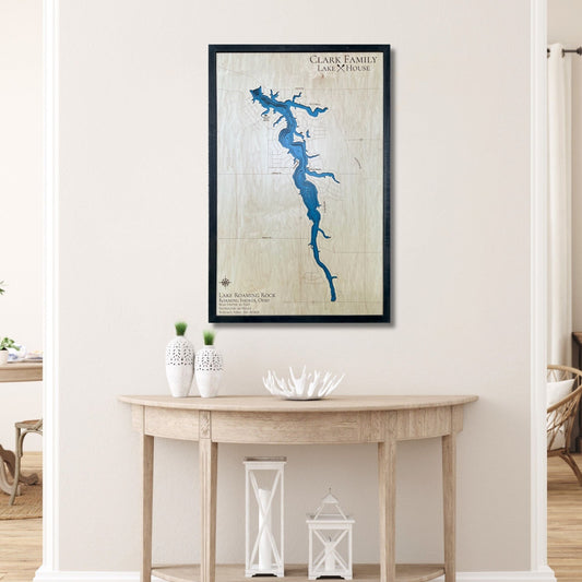 Custom wooden map of Lake Roaming Rock on a wall above a wooden console table.