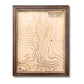 Custom wooden topographic map with house icon and personalized text. 