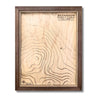 Custom wooden topographic map with house icon and personalized text. 