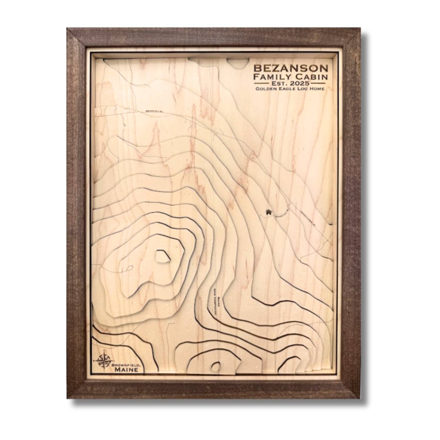 Custom wooden topographic map with house icon and personalized text. 