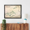 Framed wooden golf map of Lincolnshire Country Club on a wall above a wooden console table.