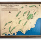 A wooden map of Manele Golf course in Lanai, Hawaii. Map is on a plain white background.
