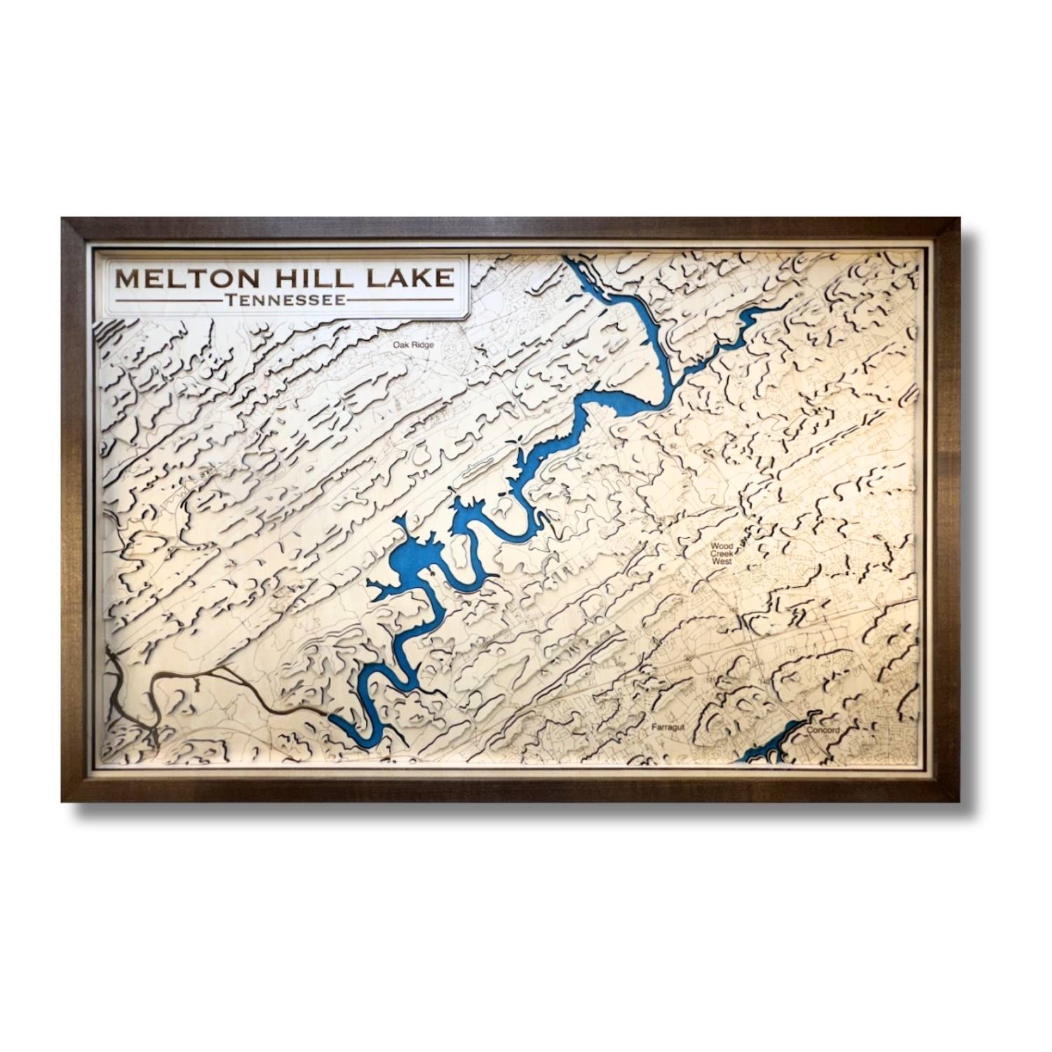 Framed topographic map of Melton Hill Lake, Tennessee with a brown frame and blue water stain. 