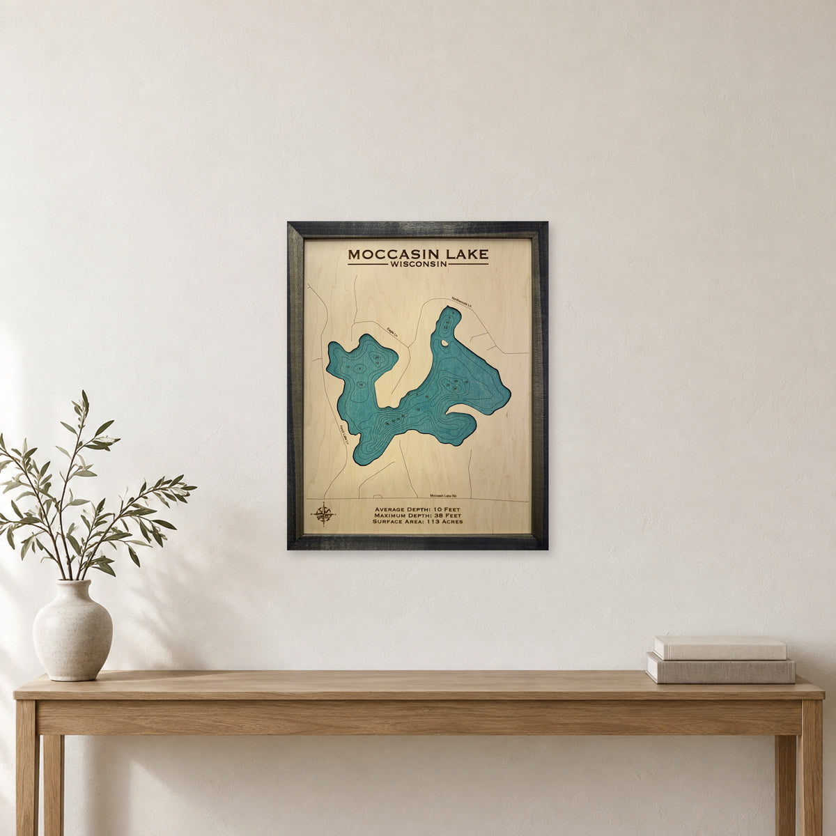 Moccasin Charcoal wood map — single layer with engraved contours, staged room mockup