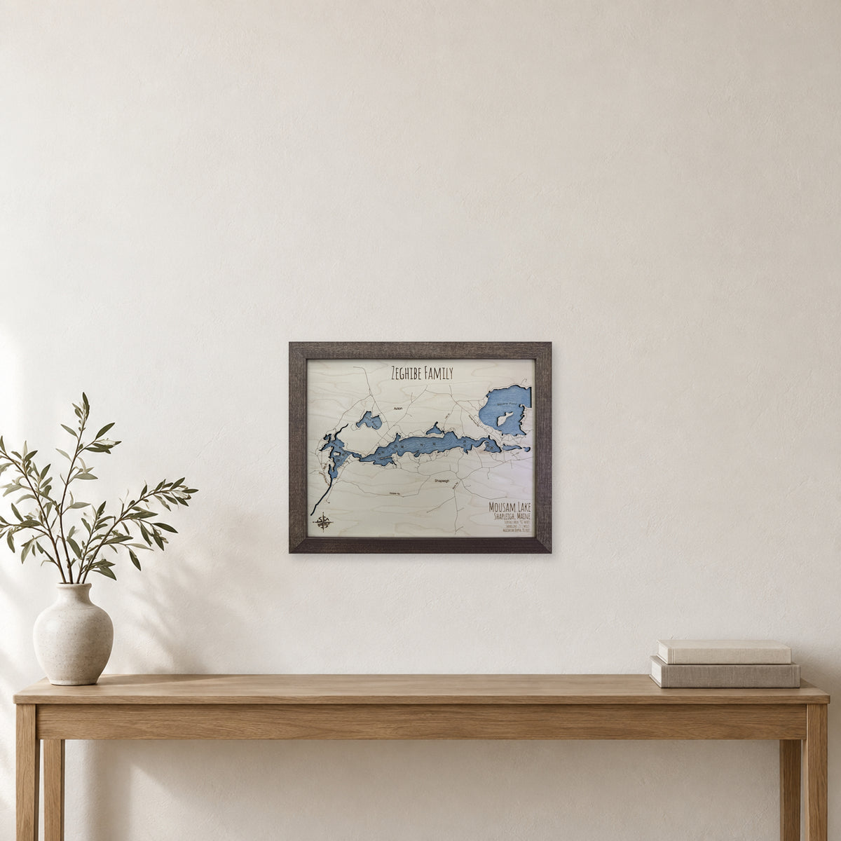 Mousam Zeghibe wood map — single layer with engraved contours, staged room mockup