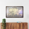 Framed wooden map of National Parks on a wall above a wooden cabinet.