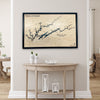 Custom Norris Lake map hanging on a wall above a table with decorative items. 