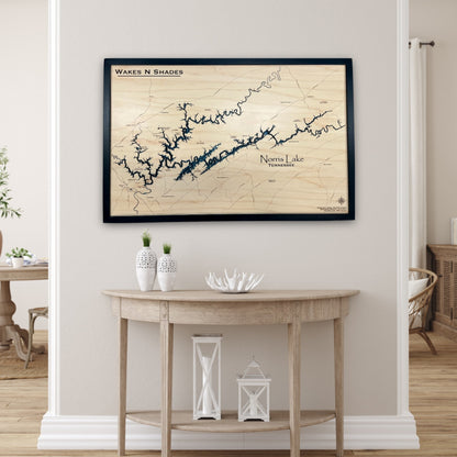 Custom Norris Lake map hanging on a wall above a table with decorative items. 