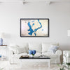 Large Okoboji Lakes wooden map hanging on wall above a couch. 