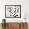 Framed wooden map of Old Sandwich Golf Club above a wooden console table with decor items.