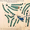 Close up of wooden golf course map with green fairways, blue water hazards, and engraved text. 