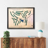 Framed wooden map of Old York Road Country Club on a wall above a wooden console table.