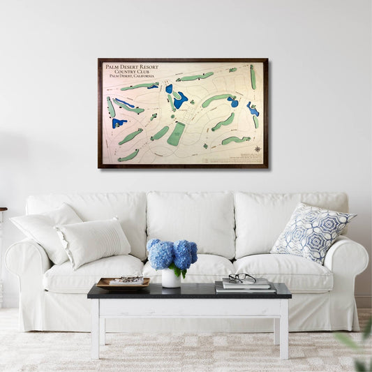 Living room with a white sofa, coffee table, and framed golf course map on the wall.