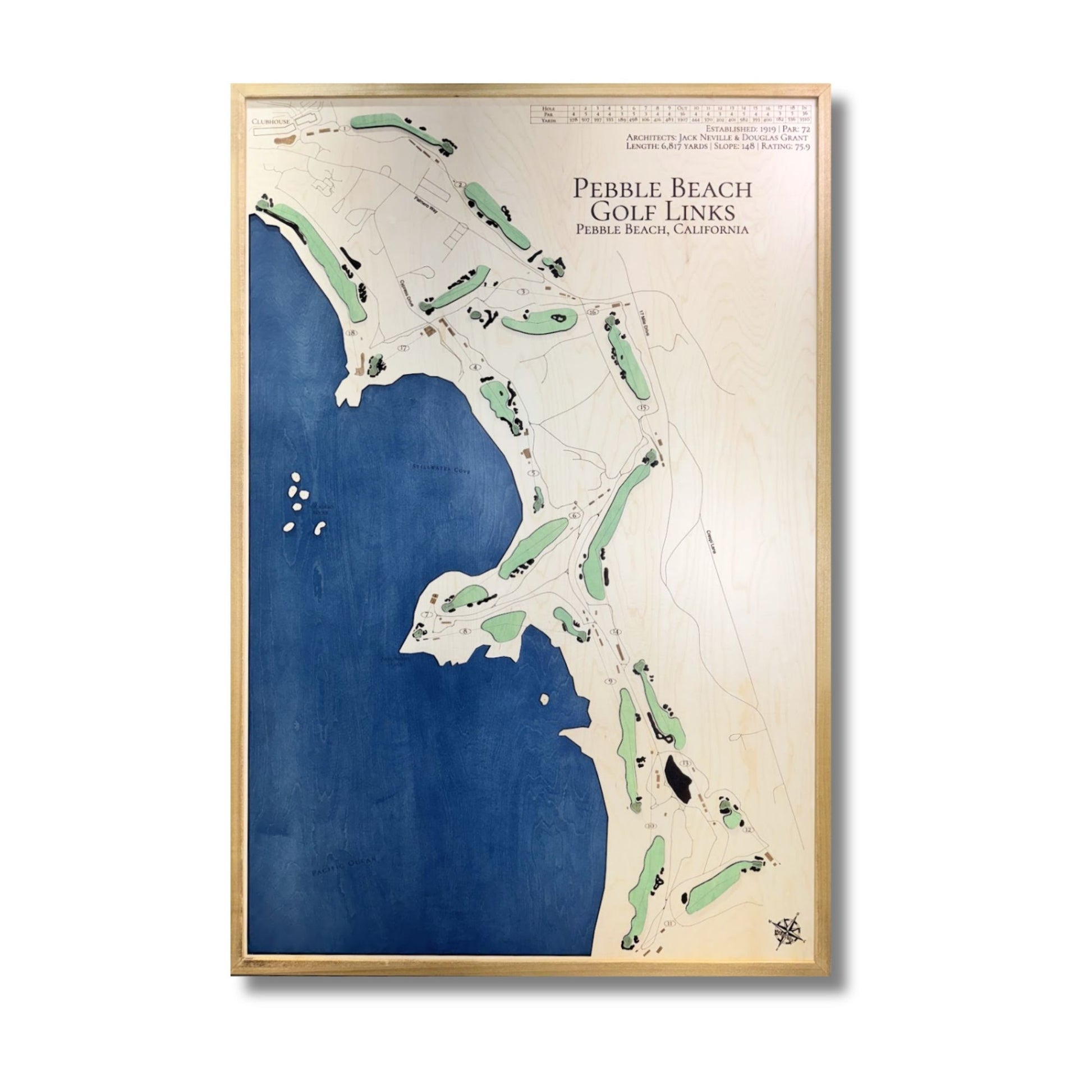 Vertical layout of Pebble Beach golf map with dark blue water stain and raised green greens. 