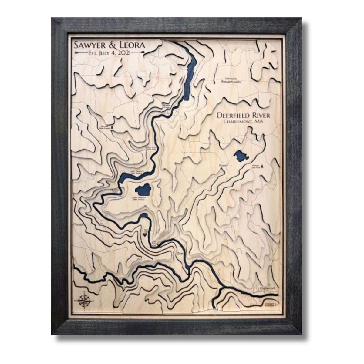 Wooden multilayer topographic map with water features and personalized text. 