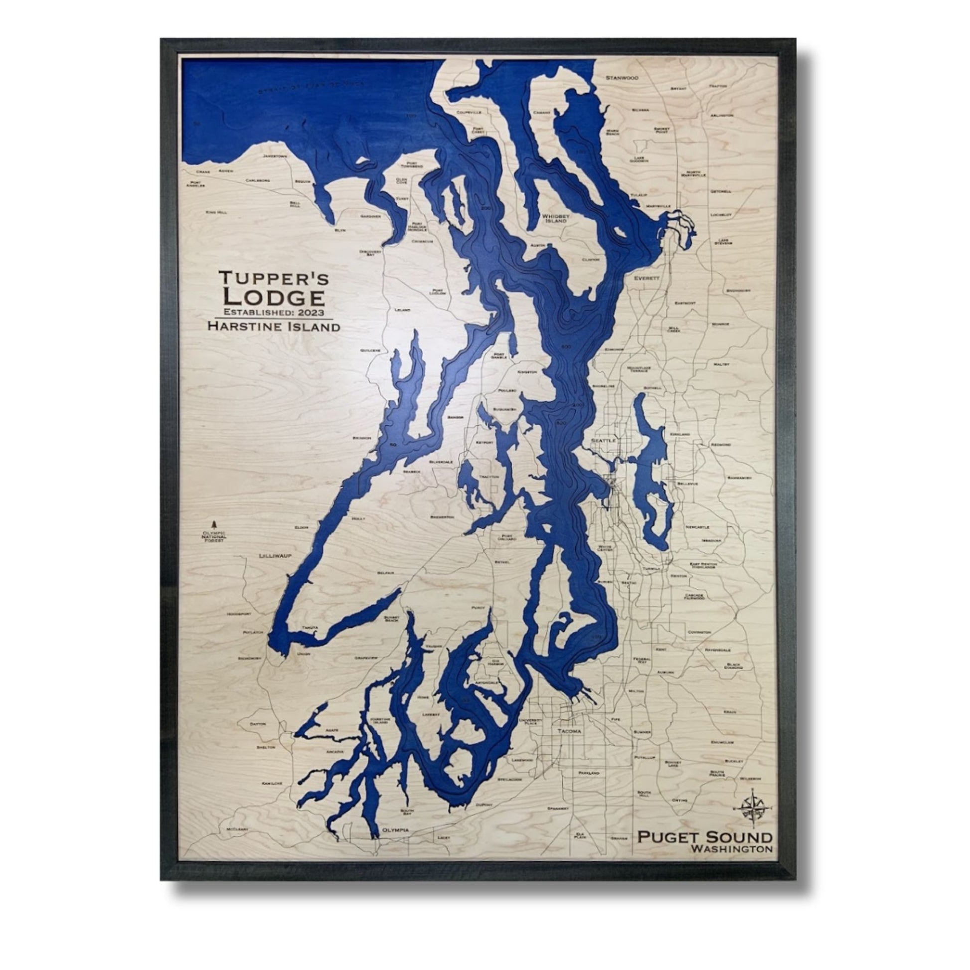 Custom map of Puget Sound with dark blue water stain and a black frame. 