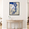 Custom wooden map of Puget Sound hanging on a wall above a table. 