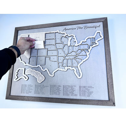 Wooden US travel map with removable pieces. Image shows some state pieces in place. 