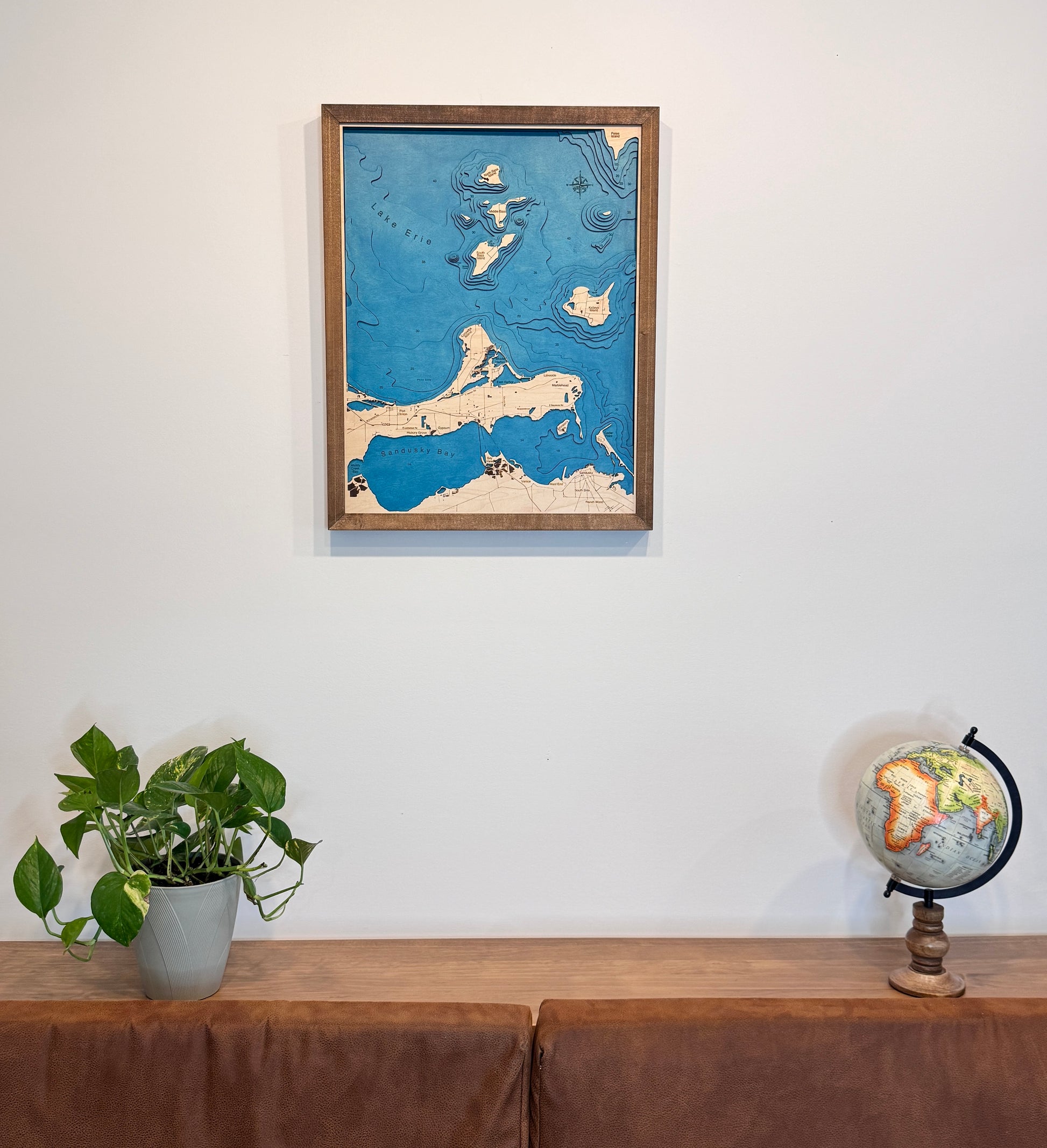 Sandusky Bay Island wood map hanging on the wall. 