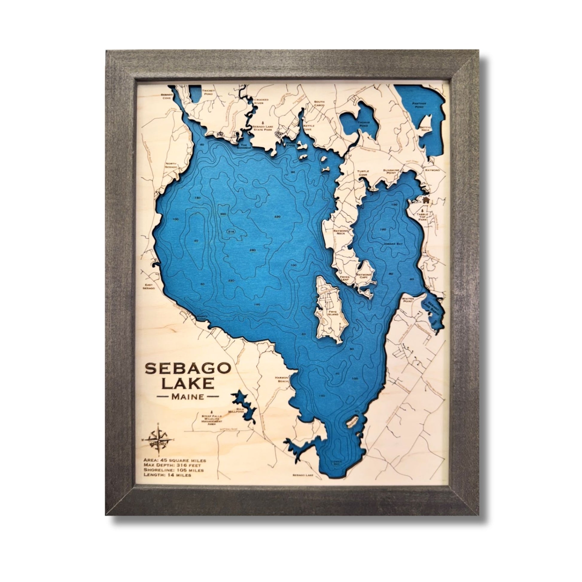 Engraved water layers on a Sebago Lake wooden map with a brown frame. 