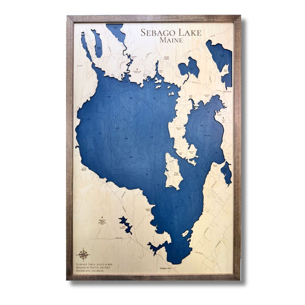 Engraved water layer map of Sebago Lake with dark blue water stain. 