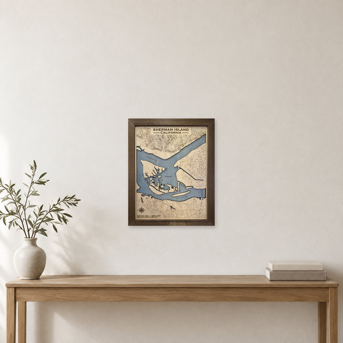 Sherman Island wood map — single layer with engraved topography, staged room mockup