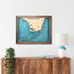 Framed South Florida and Florida Keys map hanging on a wall above a console. 