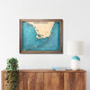 Framed South Florida and Florida Keys map hanging on a wall above a console. 