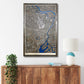 Framed city map of Tokyo on a wall above a wooden cabinet with decorative items.