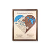 A 3D wooden heart-shaped map split into two sections, yin yang style, with each side showing a different city. 