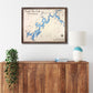 Framed wooden map of Watts Bar Lake, Tennessee on a wall above a wooden console table.