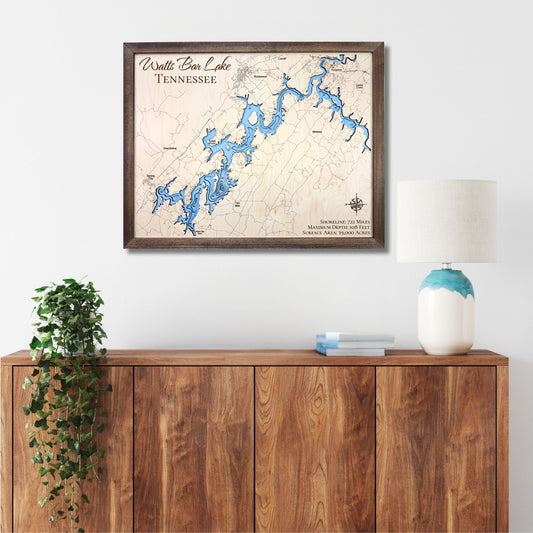 Framed wooden map of Watts Bar Lake, Tennessee on a wall above a wooden console table.