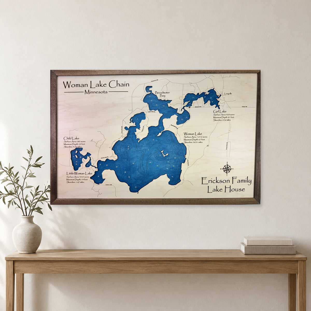 Woman Lake Erickson wood map — single layer with engraved contours, staged room mockup